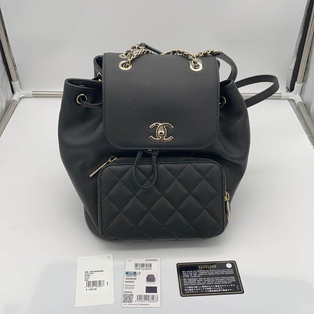 CHANEL Black Backpack with Gold Accents
